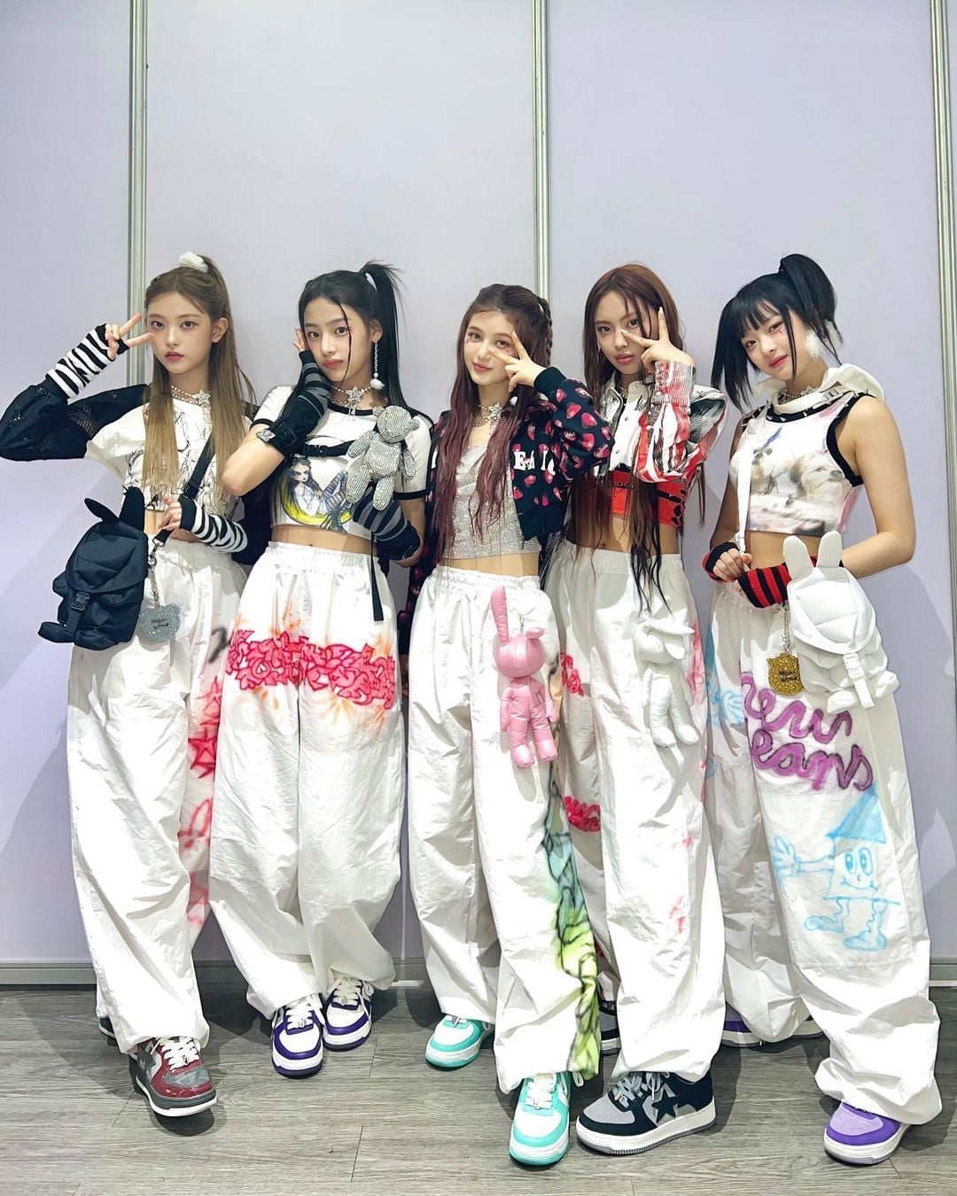 Bold graphic cargo pants and cropped tops Bold graphic cargo pants and cropped tops — K-pop Outfits