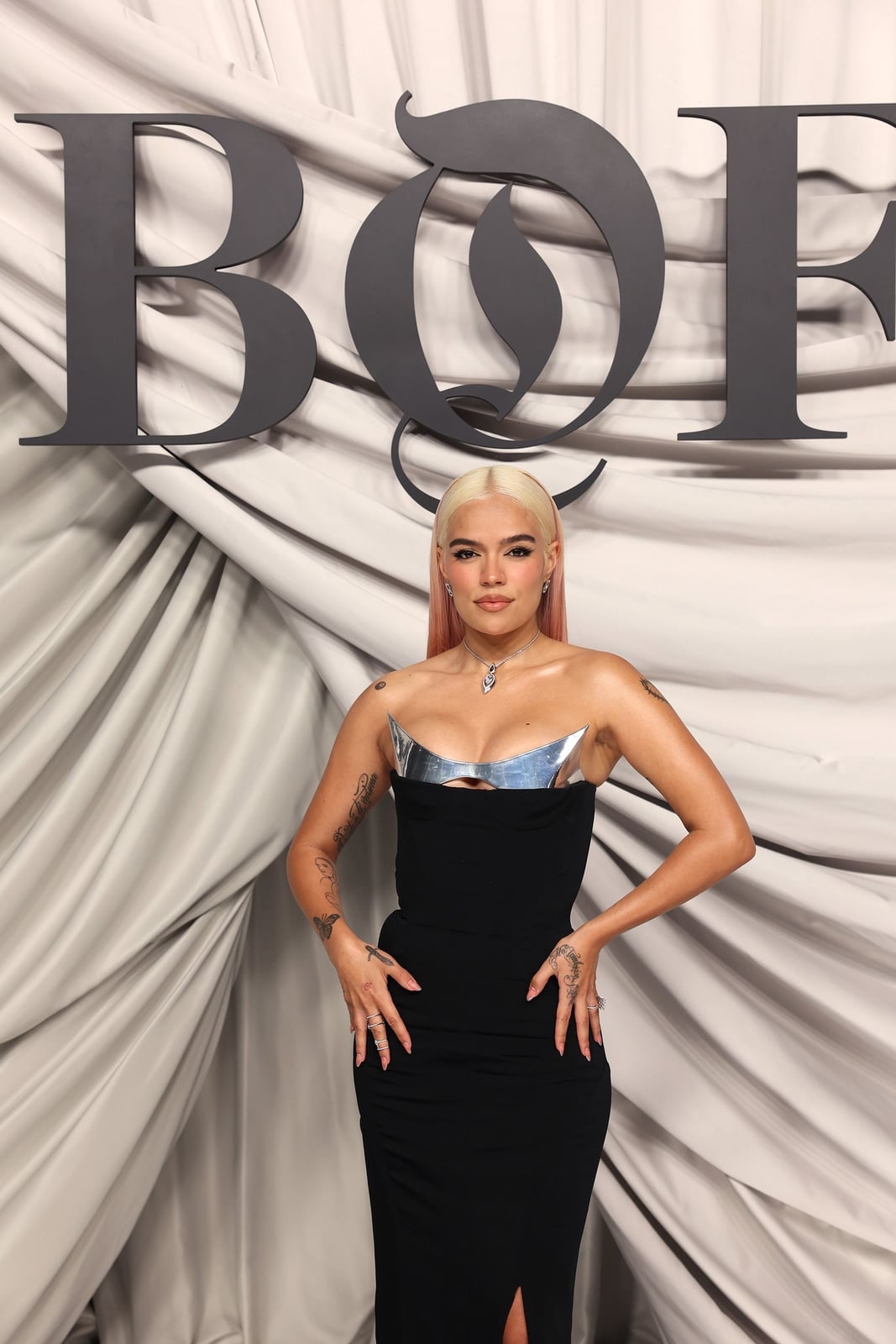 Black strapless dress with metallic bustier detail Black strapless dress with metallic bustier detail — Karol G Outfit