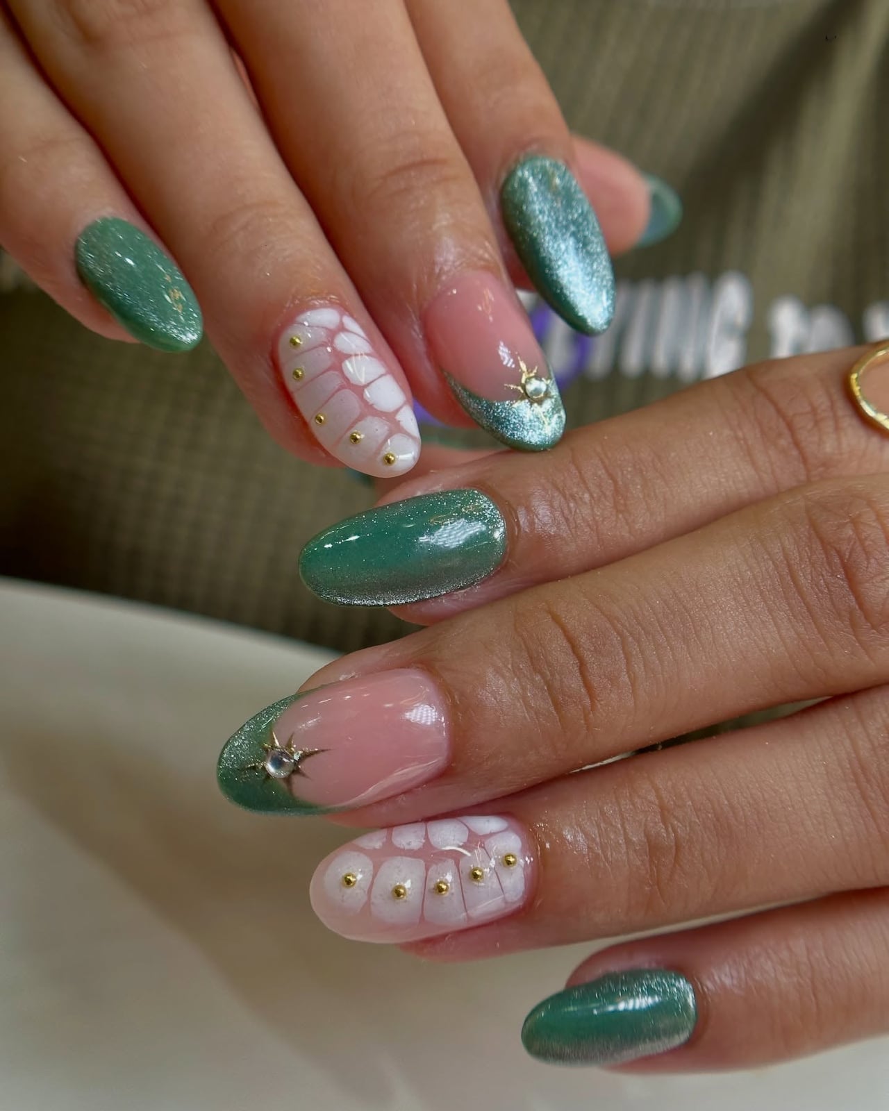 Emerald Green Shimmer Oval Nails with Floral Art Emerald Green Shimmer Oval Nails with Floral Art — Katseye Nails