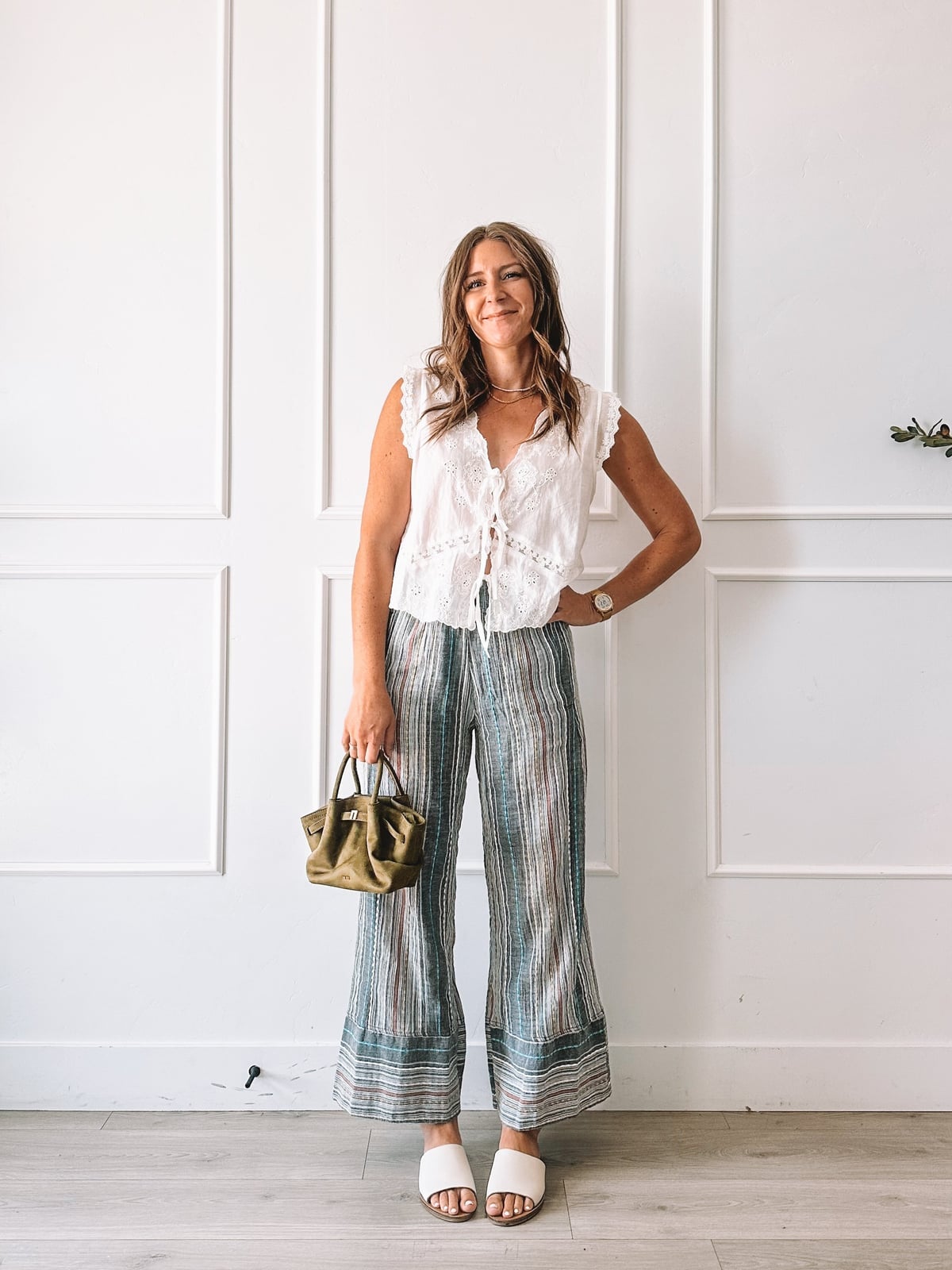 White Lace Sleeveless Top With Striped Wide Leg Trousers White Lace Sleeveless Top With Striped Wide Leg Trousers — Lace Top Outfit