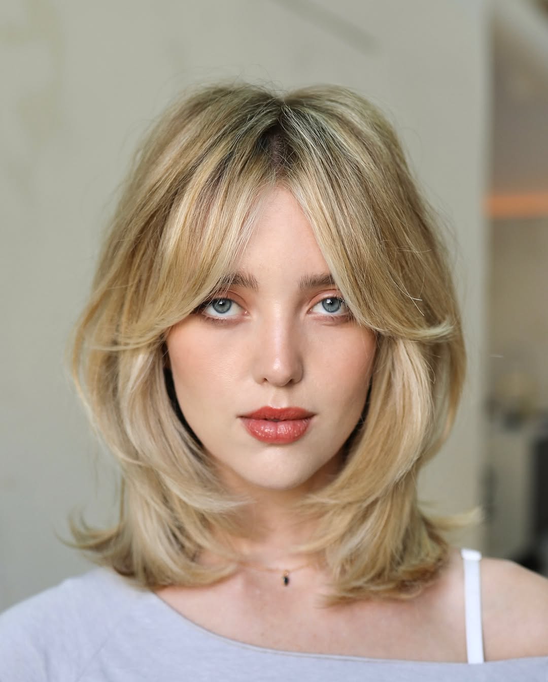 Collarbone Ash Blonde Bob With Curtain Bangs Collarbone Ash Blonde Bob With Curtain Bangs — Layers Hair
