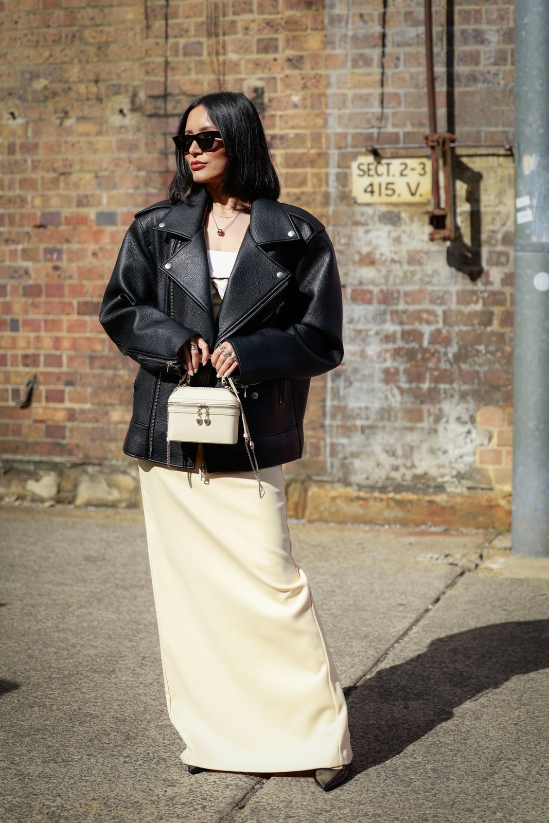 Oversized black leather biker jacket over cream maxi dress Oversized black leather biker jacket over cream maxi dress — Leather Jacket Outfits Women