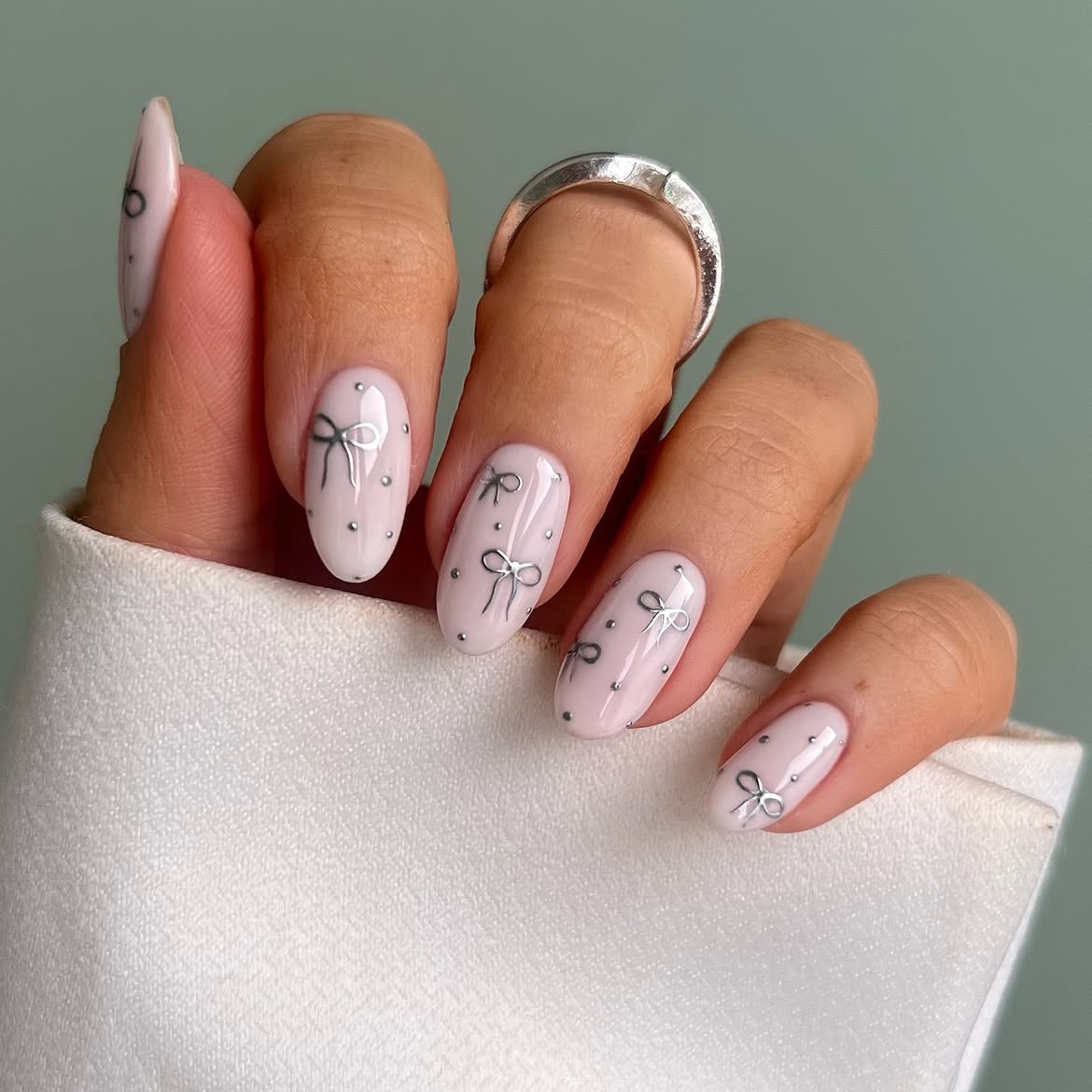 Light Pink Bow Accent Almond Nails