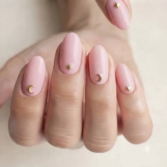 Opaque Light Pink Glossy Medium Almond With Celestial Charms Opaque Light Pink Glossy Medium Almond With Celestial Charms — Light Pink Nails