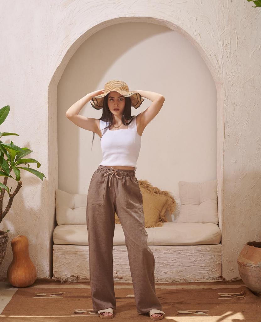 Brown wide-leg linen pants with a white tank and straw hat, Neutral Brown wide-leg linen pants with a white tank and straw hat, Neutral — Linen Pants Outfits