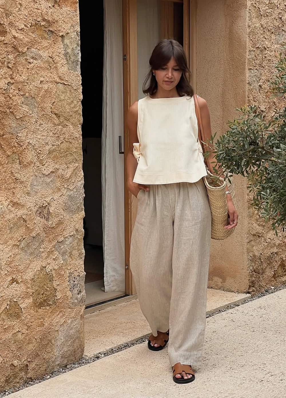 Cream wide-leg linen pants with matching sleeveless top and straw tote Cream wide-leg linen pants with matching sleeveless top and straw tote — Linen Pants Outfits