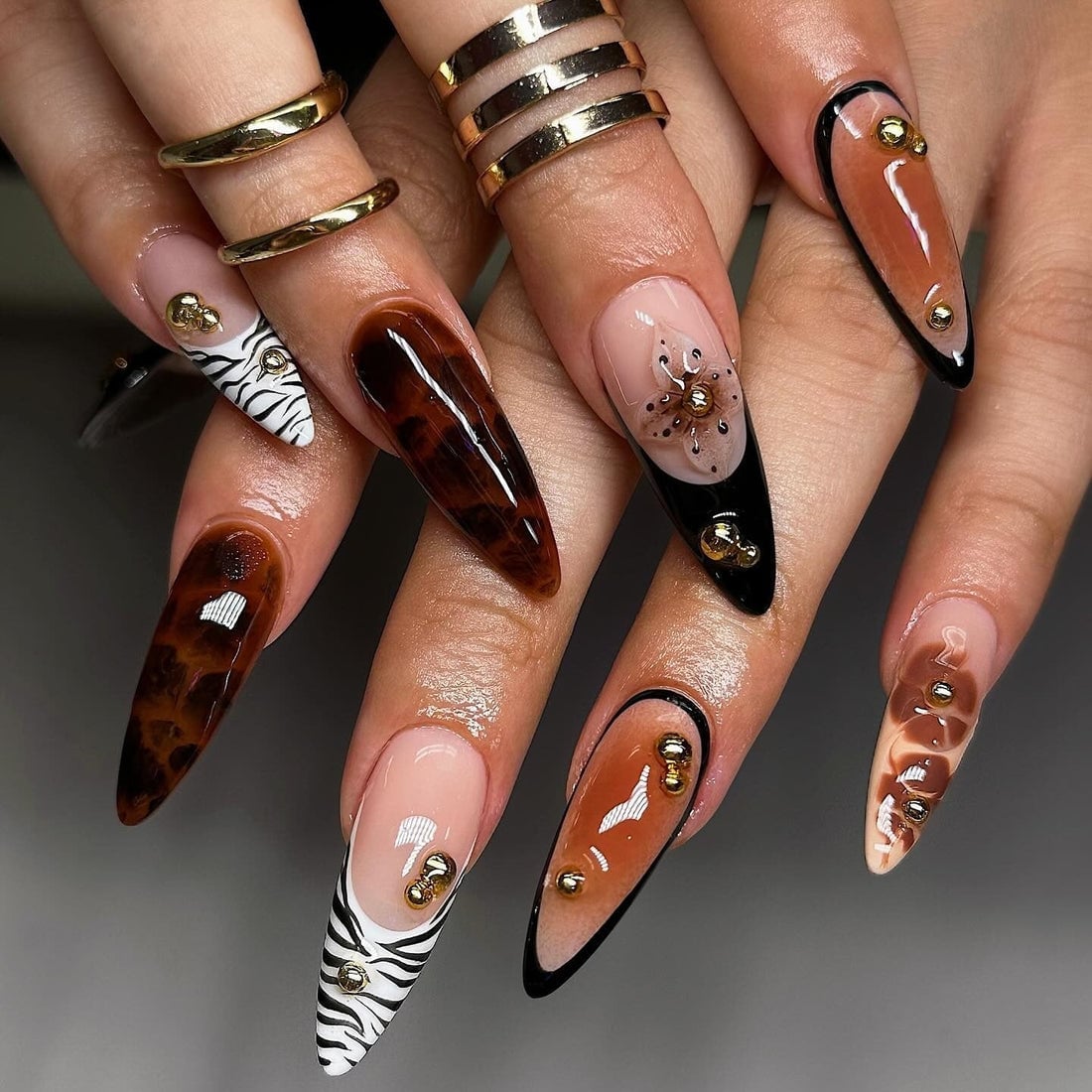 Tortoiseshell Zebra Black Gold Studded Long Almond Nails Tortoiseshell Zebra Black Gold Studded Long Almond Nails
