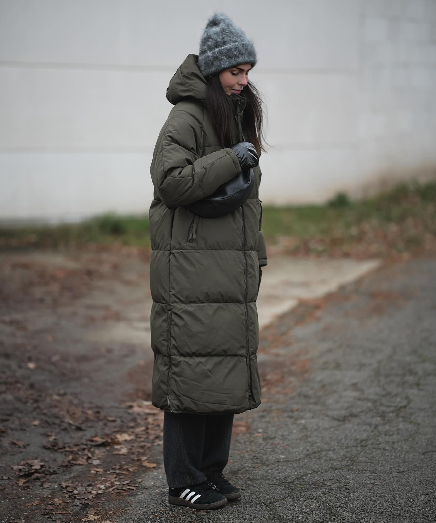 Long Olive Puffer With Wide Leg Trousers And Sneakers
