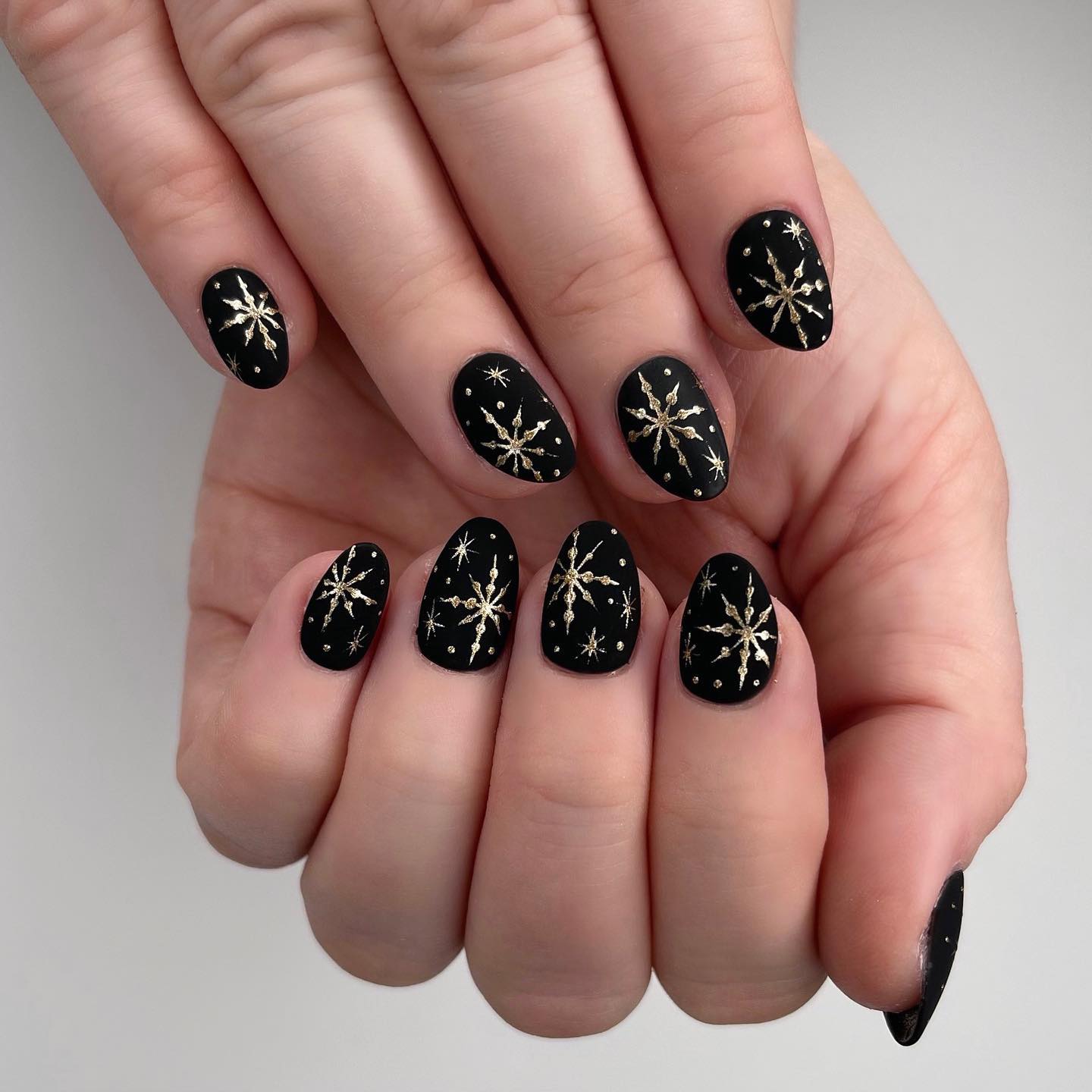 Matte Black Gold Snowflake Starburst Nails