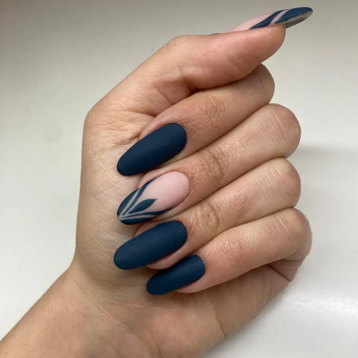 Matte Navy Blue Almond Nails With Leaf Art