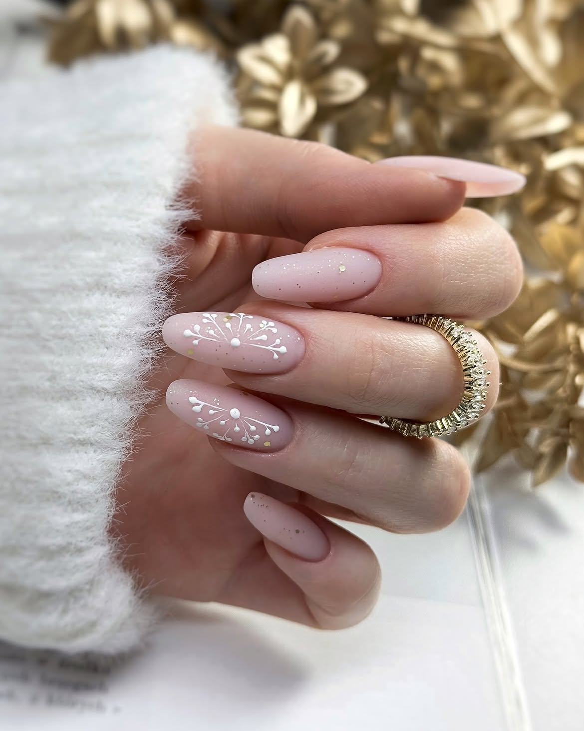 Matte Pink Almond Nails With White Snowflake Art