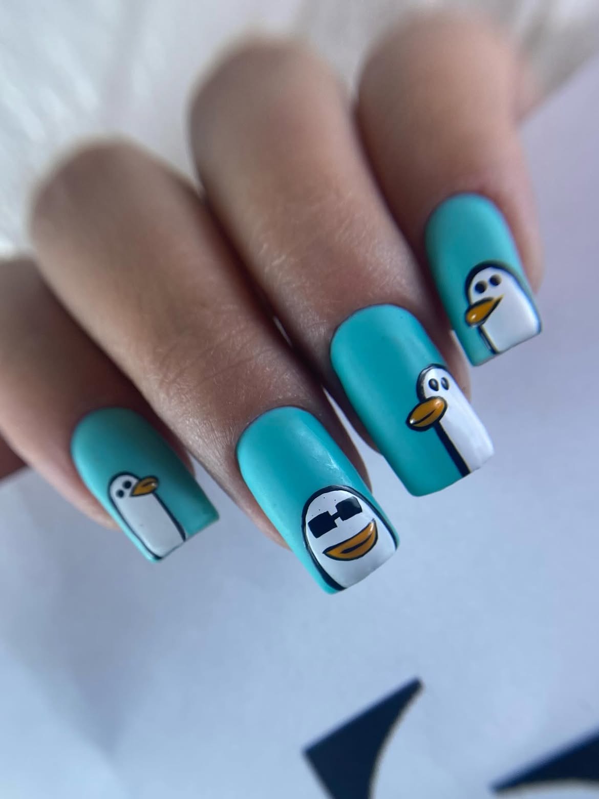 Matte Teal Penguin Nail Art