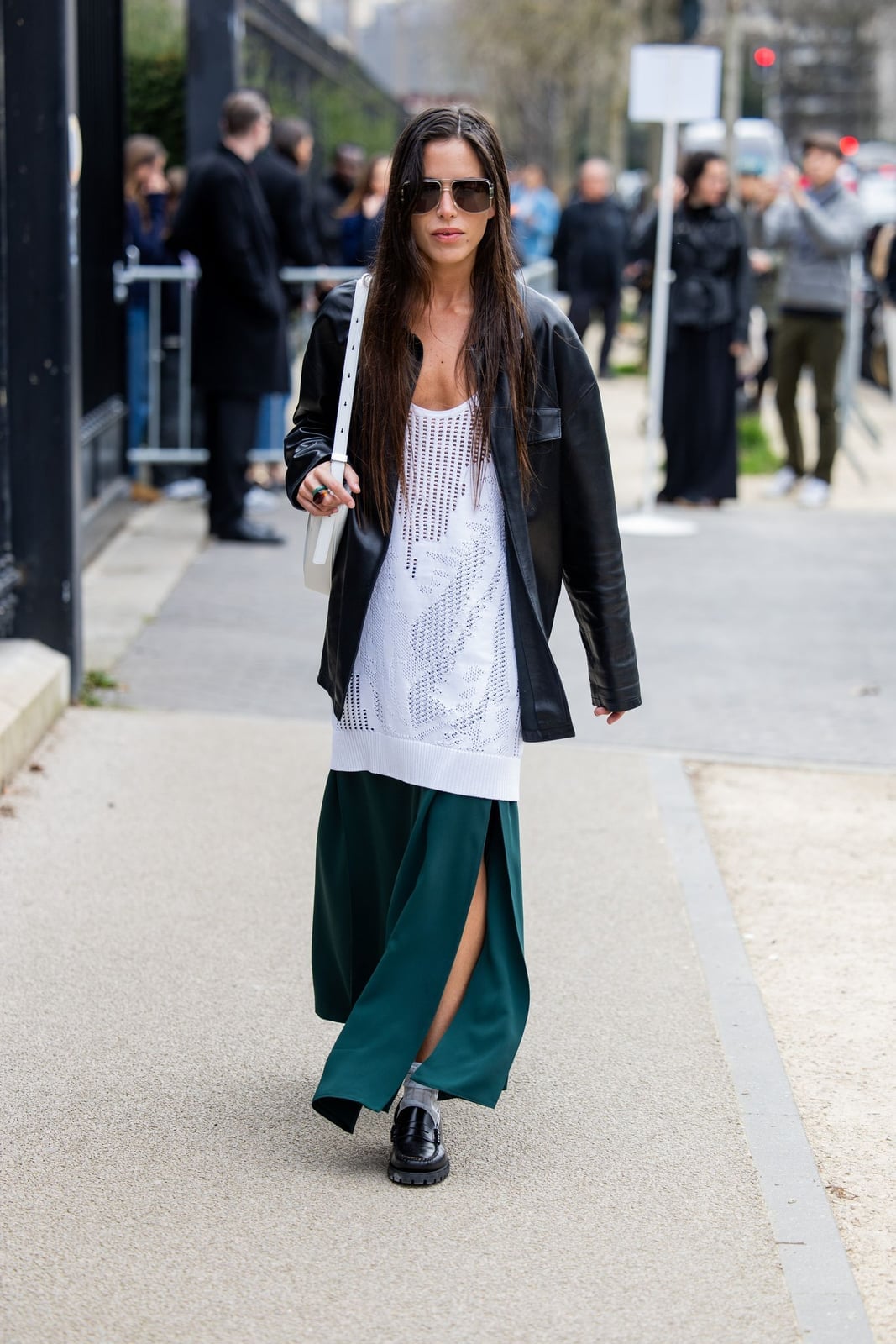A Dark Green Maxi Skirt With A High Slit Styled With A Leather Jacket A Dark Green Maxi Skirt With A High Slit Styled With A Leather Jacket — Maxi Skirt Outfits