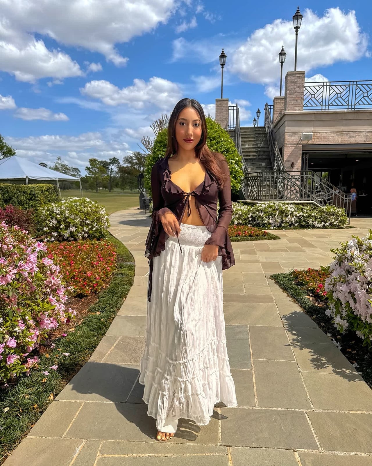 A White Tiered Maxi Skirt With A Sheer Ruffled Top A White Tiered Maxi Skirt With A Sheer Ruffled Top — Maxi Skirt Outfits
