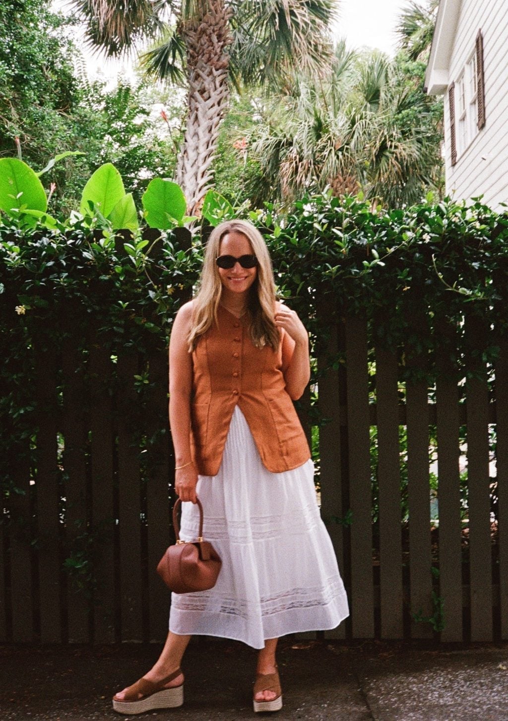 A White Tiered Maxi Skirt With An Orange Vest A White Tiered Maxi Skirt With An Orange Vest — Maxi Skirt Outfits