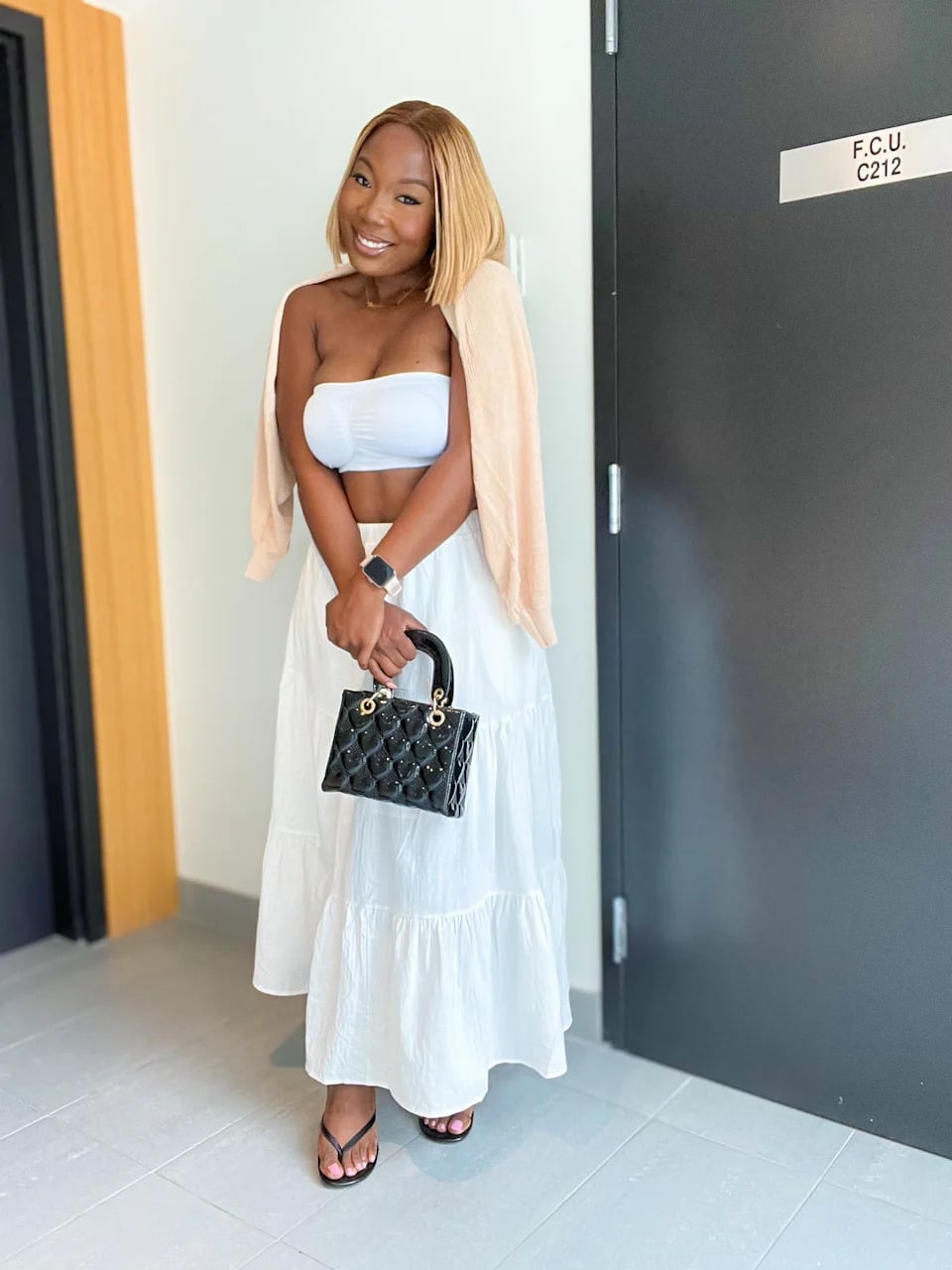 A White Tiered Maxi Skirt With A Peach Cardigan A White Tiered Maxi Skirt With A Peach Cardigan — Maxi Skirt Outfits