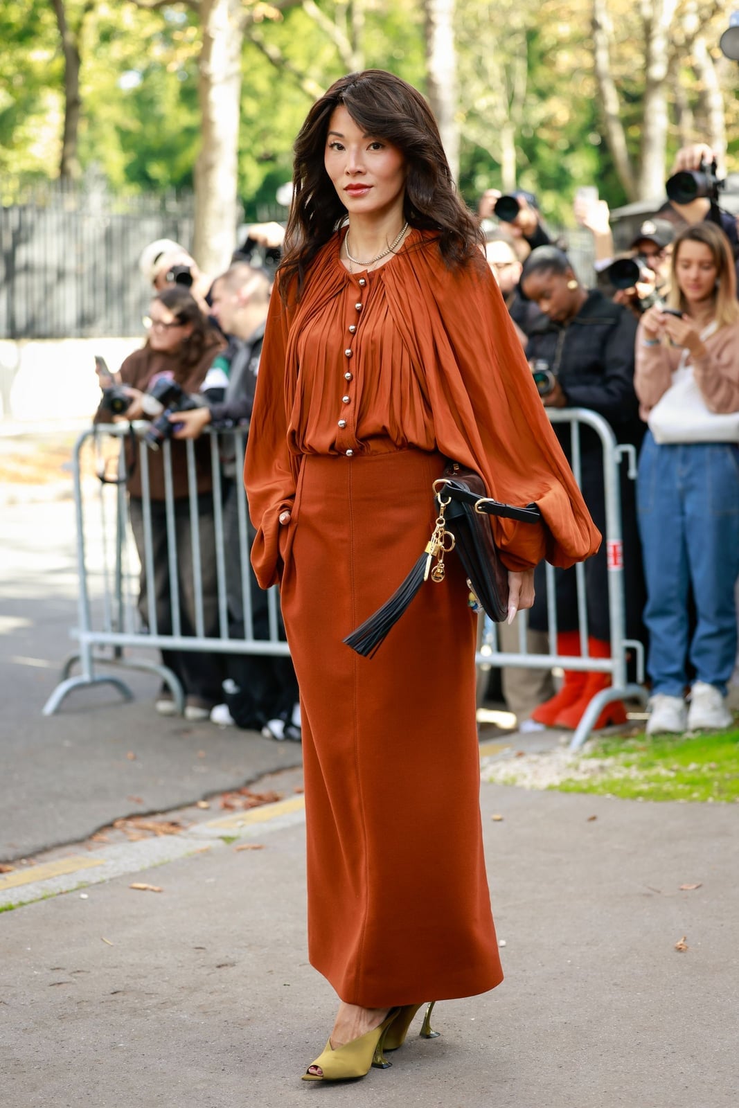 A Rust Orange Maxi Skirt With A Voluminous Pleated Blouse A Rust Orange Maxi Skirt With A Voluminous Pleated Blouse — Maxi Skirt Outfits