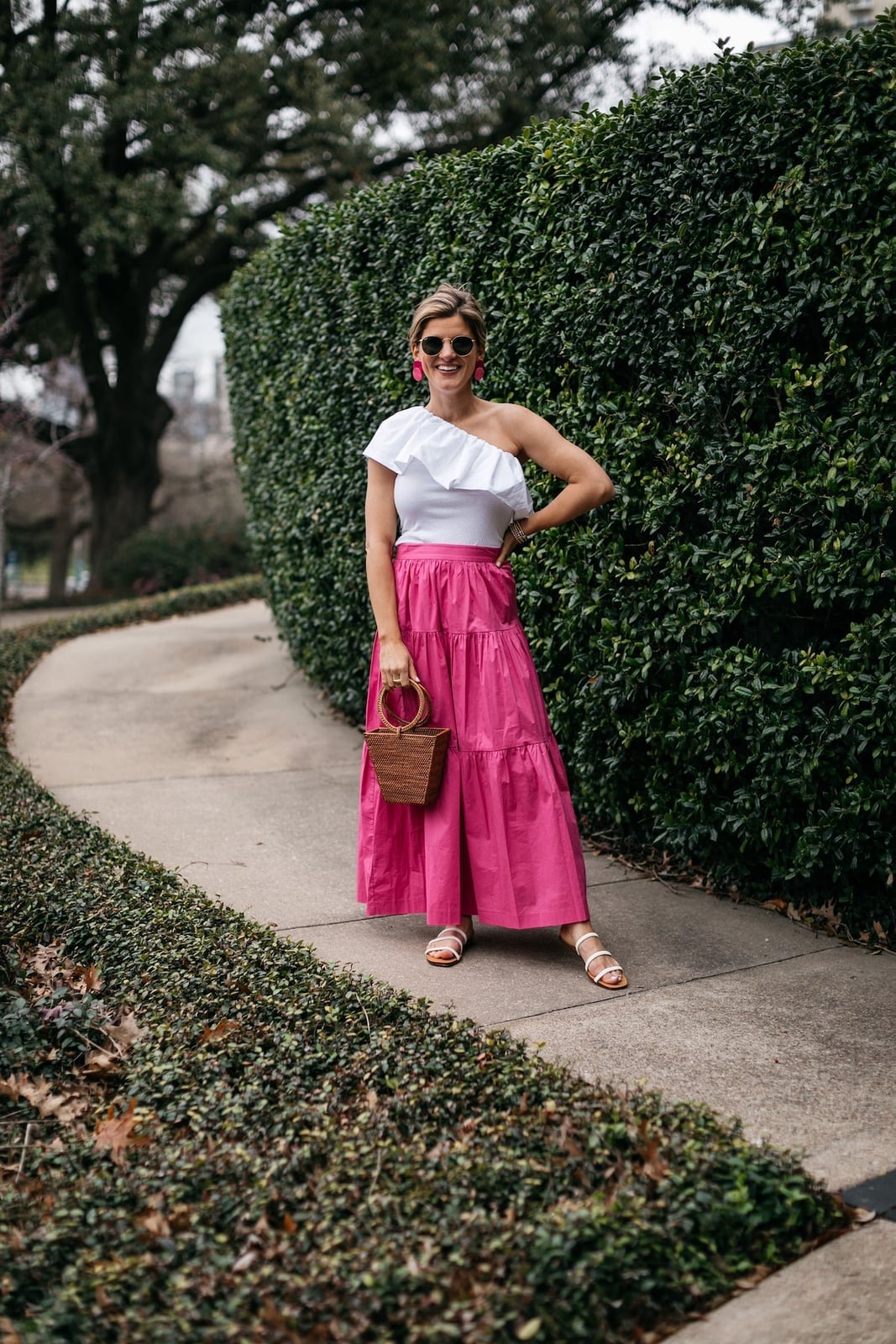 A Bright Pink Tiered Maxi Skirt With A One-Shoulder Top A Bright Pink Tiered Maxi Skirt With A One-Shoulder Top — Maxi Skirt Outfits