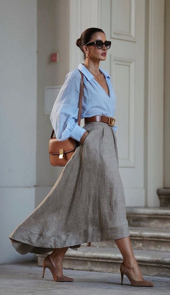 A Flowing Beige Maxi Skirt Paired With A Light Blue, Close-Up Take A Flowing Beige Maxi Skirt Paired With A Light Blue, Close-Up Take — Maxi Skirt Outfits