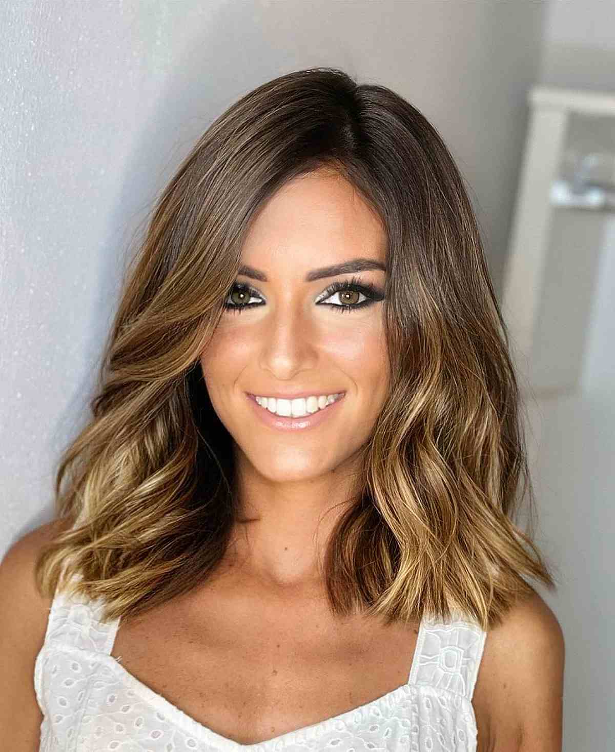 Collarbone Lob With Side-Swept Bangs Collarbone Lob With Side-Swept Bangs — Medium Hair