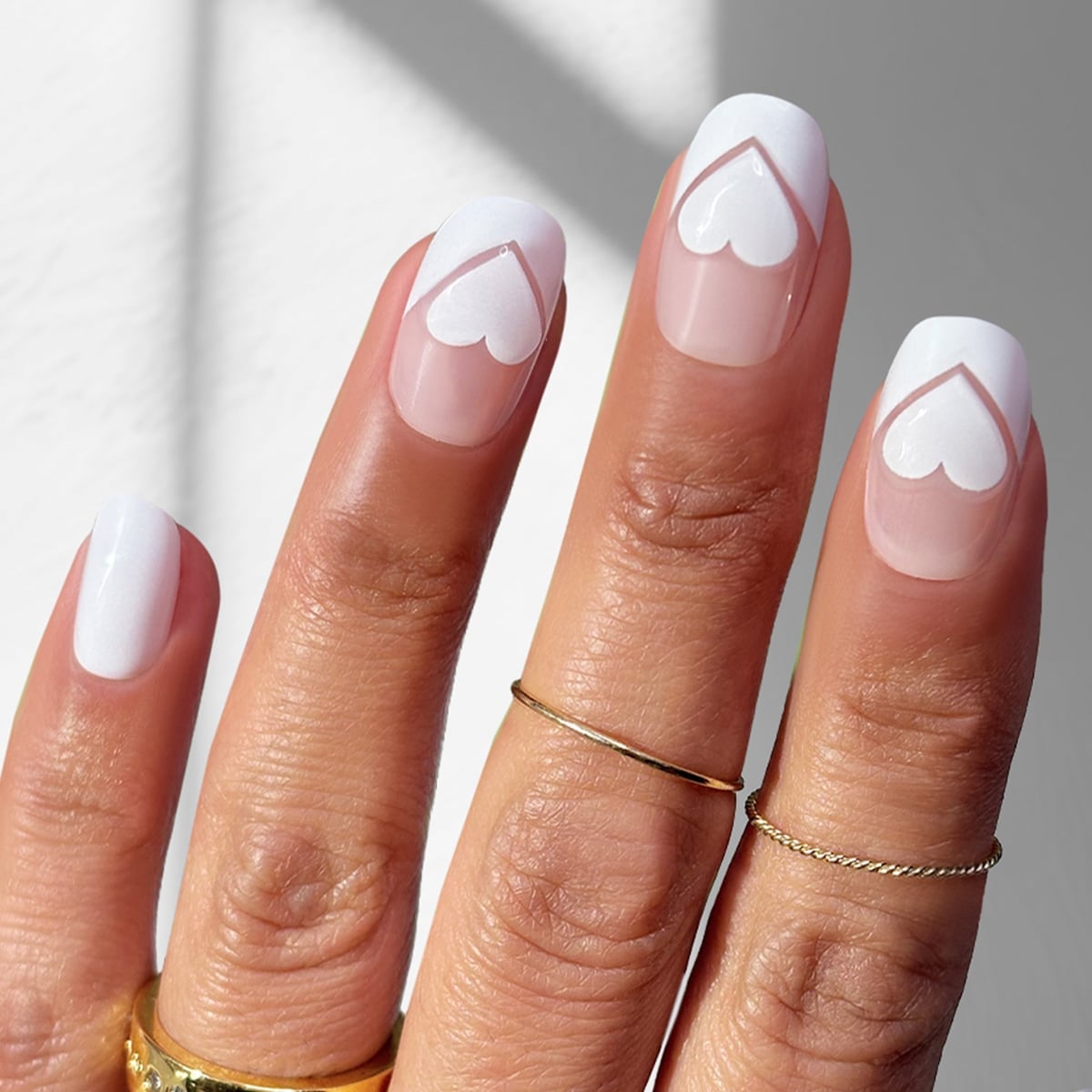 Sheer Pink Oval Nails With Heart Outline French Tips Sheer Pink Oval Nails With Heart Outline French Tips — Medium Nails
