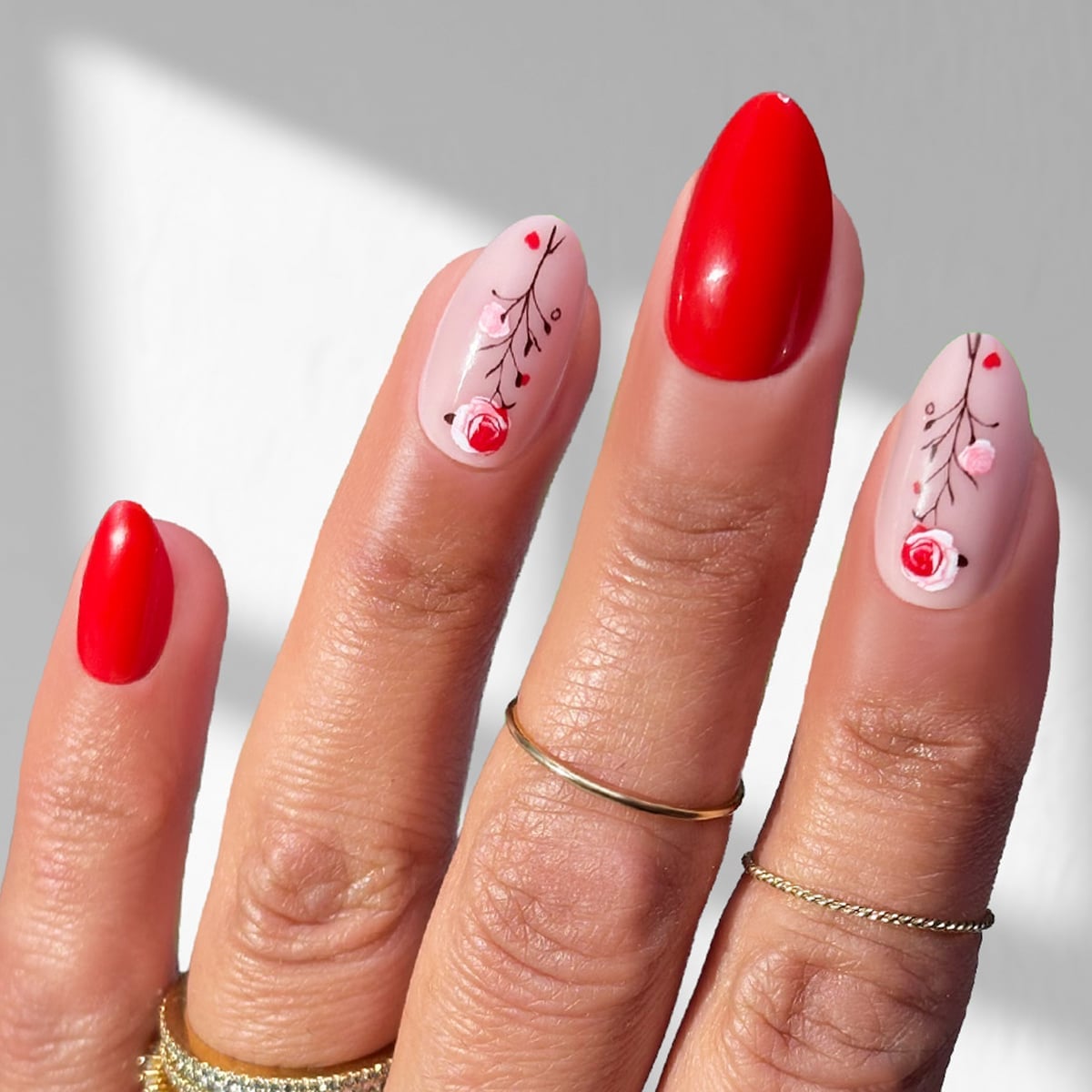Bright Red and Pink Almond Nails With Floral Art Bright Red and Pink Almond Nails With Floral Art — Medium Nails