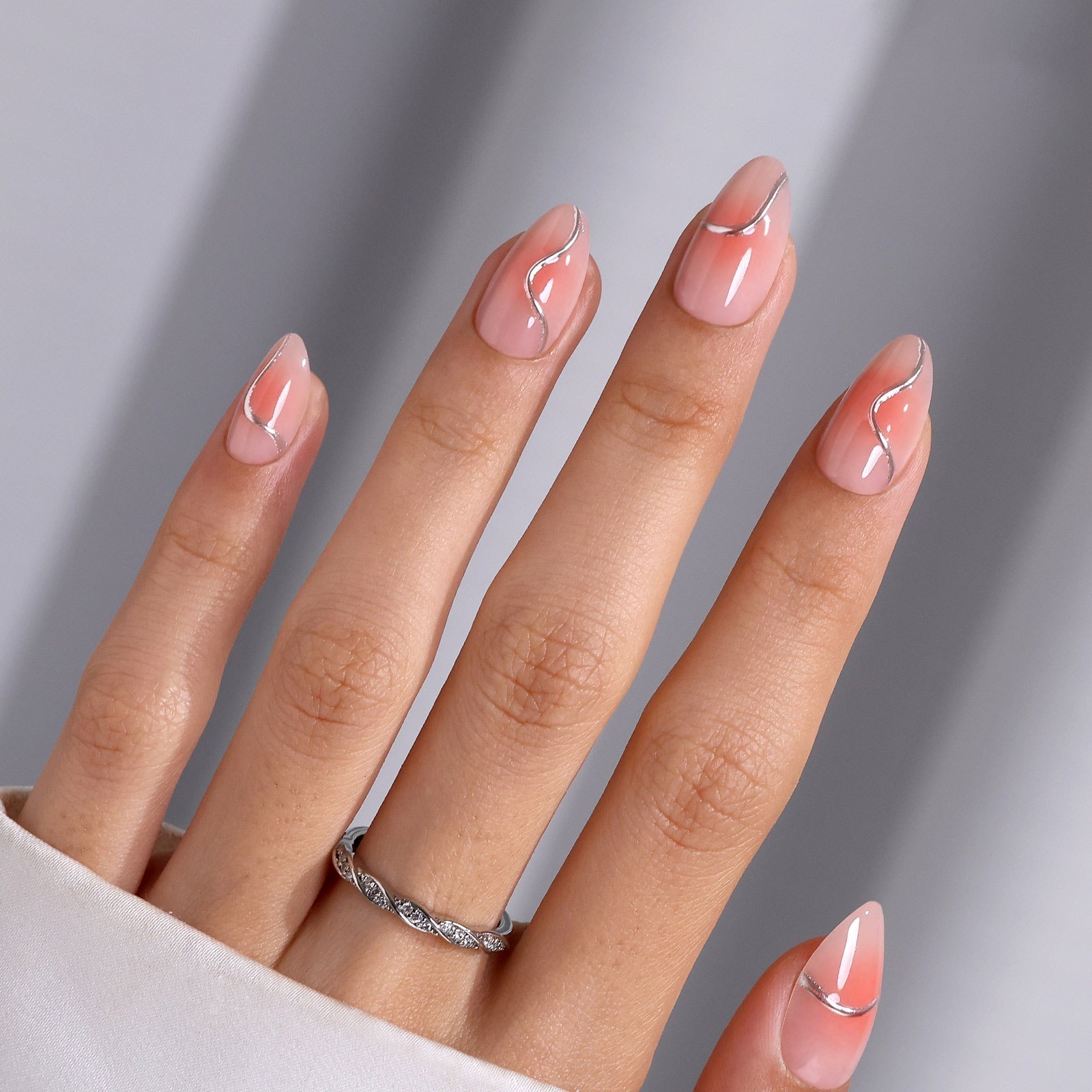 Short Almond Sheer Pink Aura With Silver Lines Short Almond Sheer Pink Aura With Silver Lines — Metallic Nails