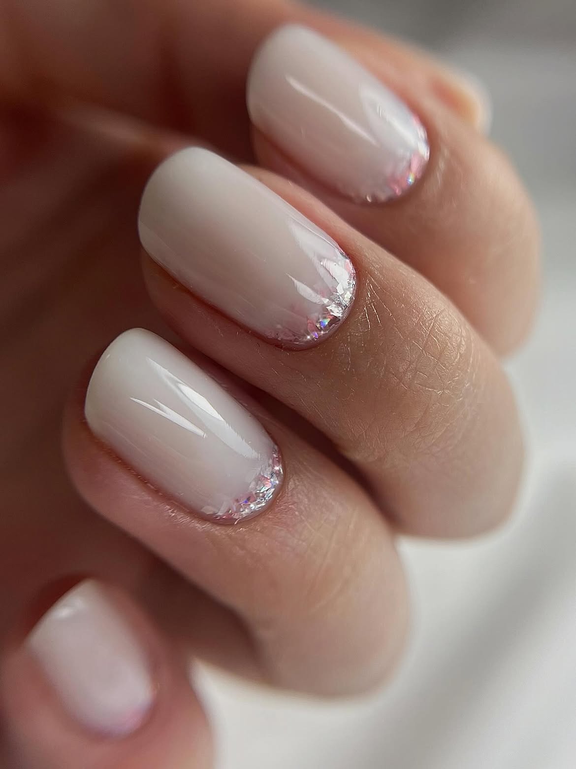 Milky White Nails With Reverse Shimmer Cuticle Accents