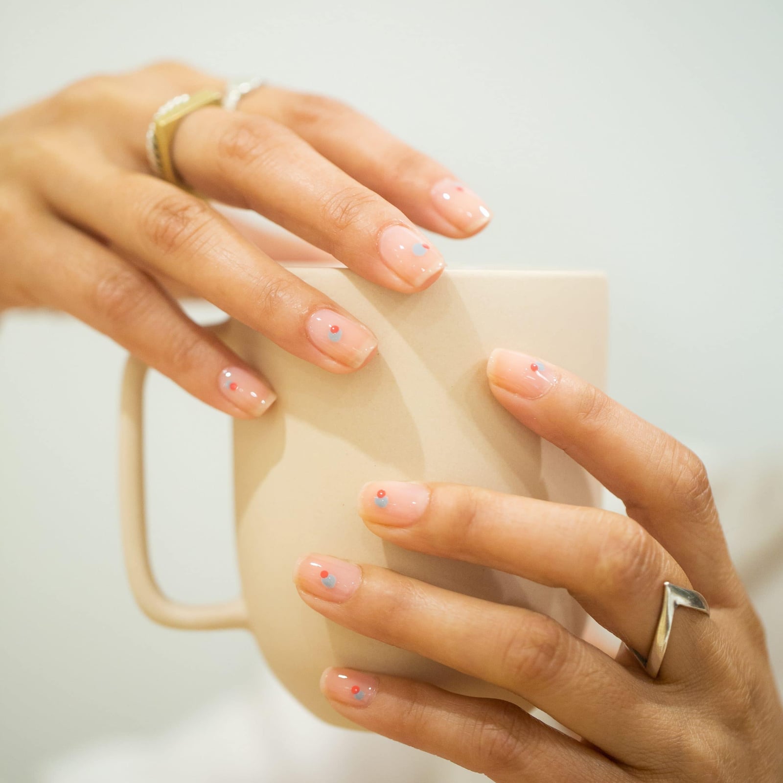 Short Square Glossy Nude With Red And Blue Dots Short Square Glossy Nude With Red And Blue Dots — Minimalist Nails