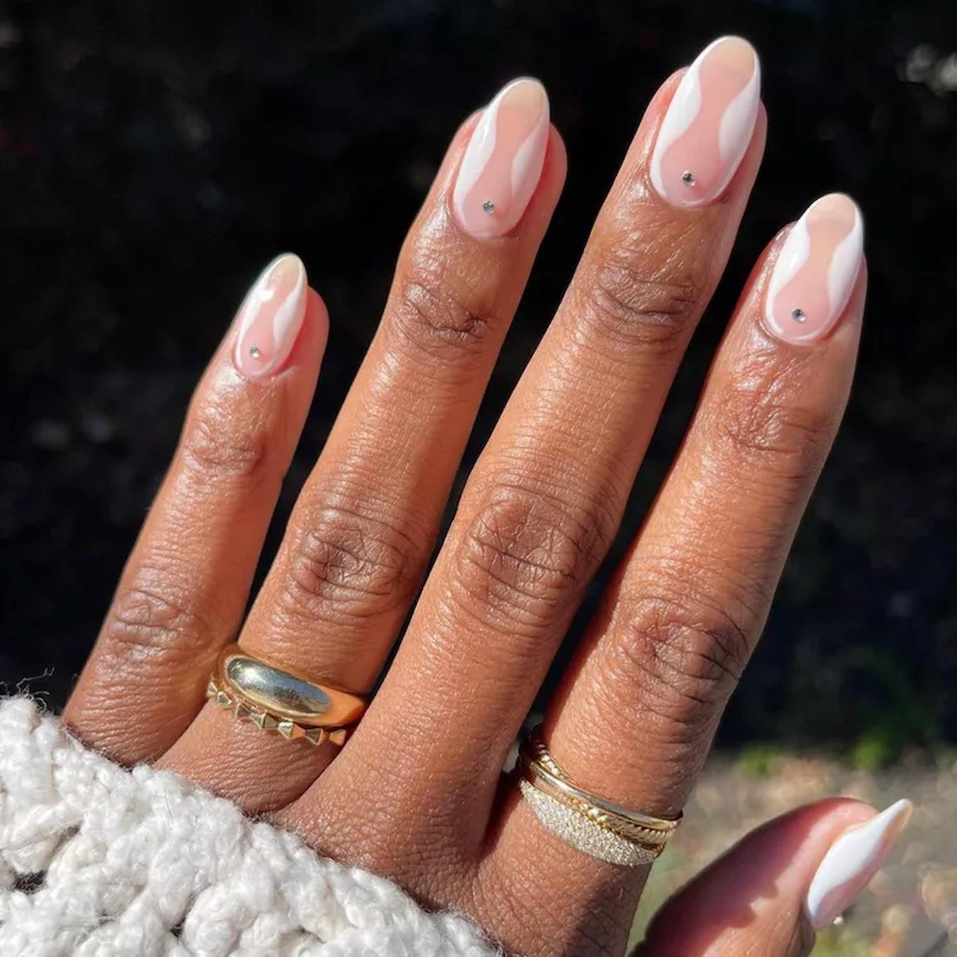 Medium Almond Nude With White Waves And Rhinestones Medium Almond Nude With White Waves And Rhinestones — Minimalist Nails