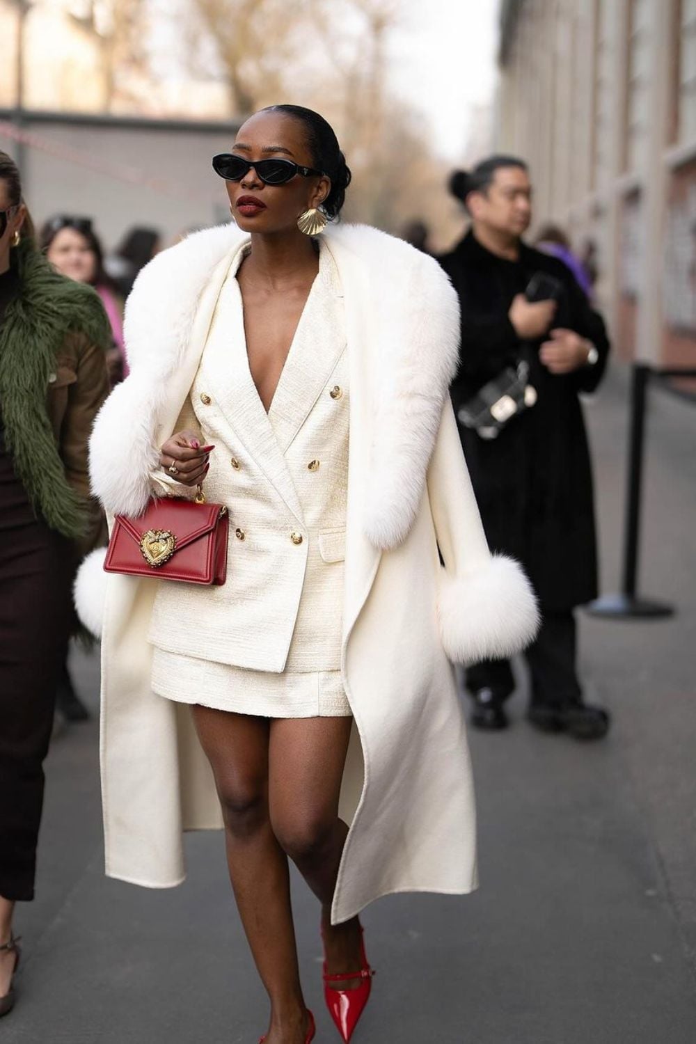 White coat with faux fur trim over white suit and red accessories White coat with faux fur trim over white suit and red accessories — Mob Wife Outfits