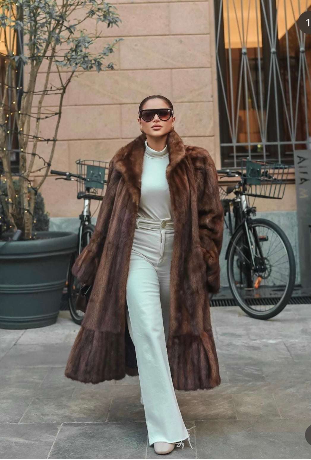 Long brown faux fur coat over cream turtleneck and wide-leg pants Long brown faux fur coat over cream turtleneck and wide-leg pants — Mob Wife Outfits