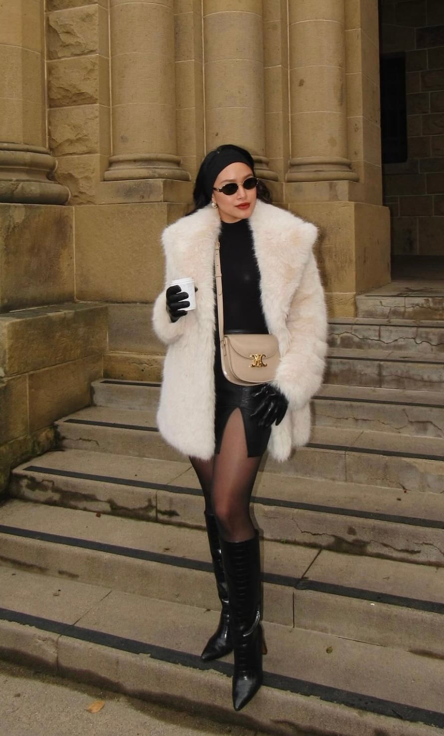 Cream oversized faux fur coat over mini skirt and knee-high boots Cream oversized faux fur coat over mini skirt and knee-high boots — Mob Wife Outfits