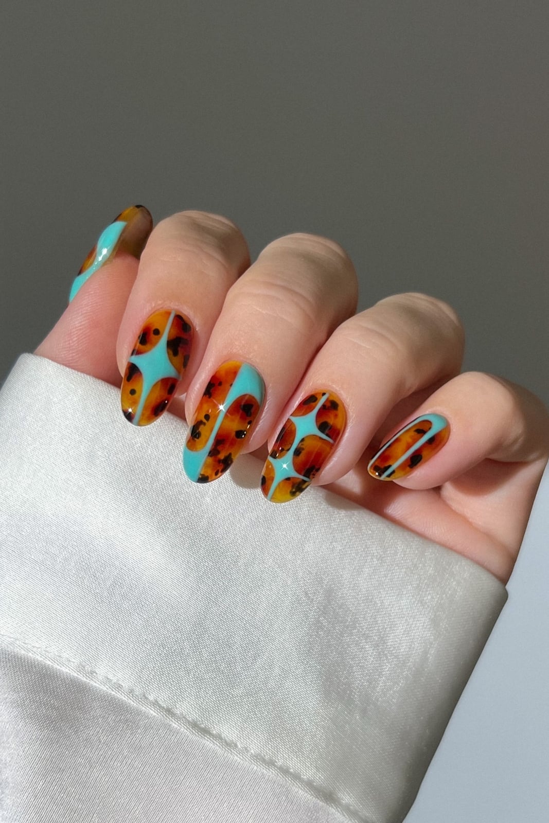 Tortoiseshell With Turquoise Medium Oval Nails Tortoiseshell With Turquoise Medium Oval Nails — Nail Art