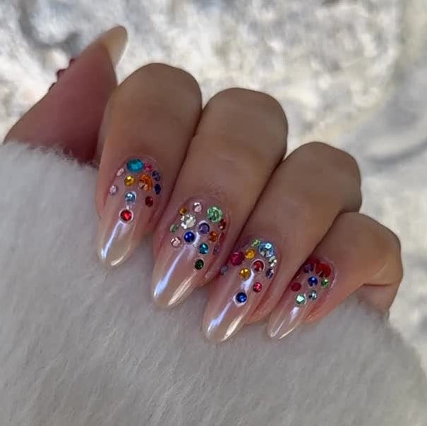 Medium Almond Nails with Pearlescent Shimmer and Colorful Gems Medium Almond Nails with Pearlescent Shimmer and Colorful Gems — Nails with Gems