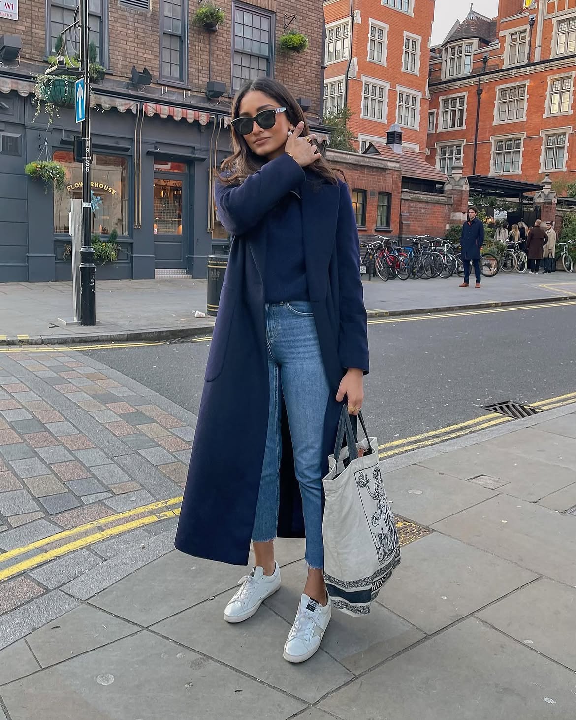Navy Long Coat Over Navy Knit And Blue Jeans