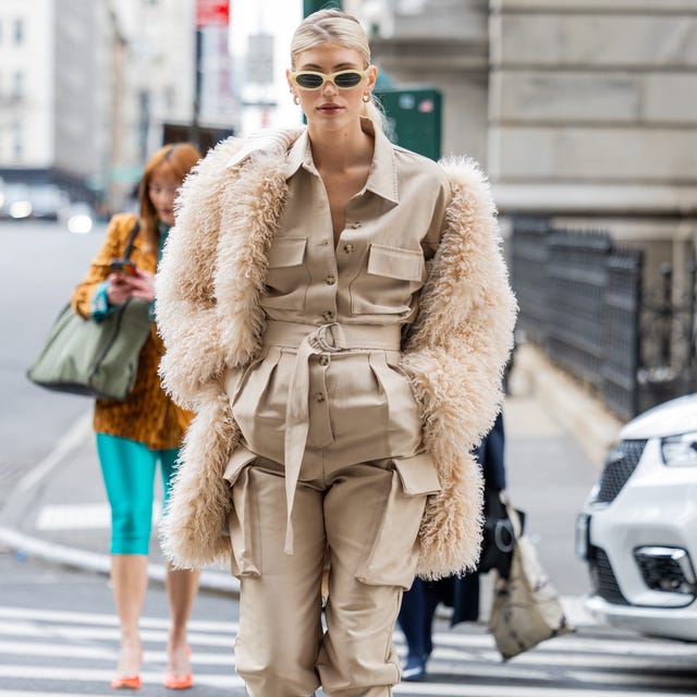 Cream shearling coat over utility jumpsuit Cream shearling coat over utility jumpsuit — New York Style