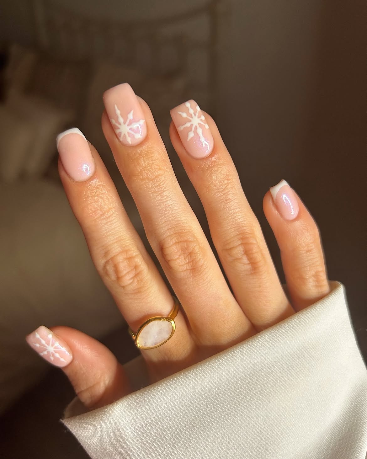 Nude French Tips with Hand-Painted Snowflakes