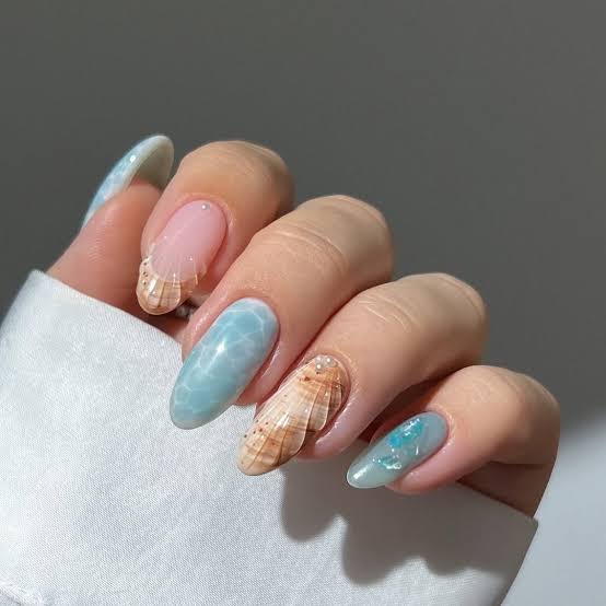 Seashell Art and Blue Marble Medium Oval Nails Seashell Art and Blue Marble Medium Oval Nails — Ocean Nails