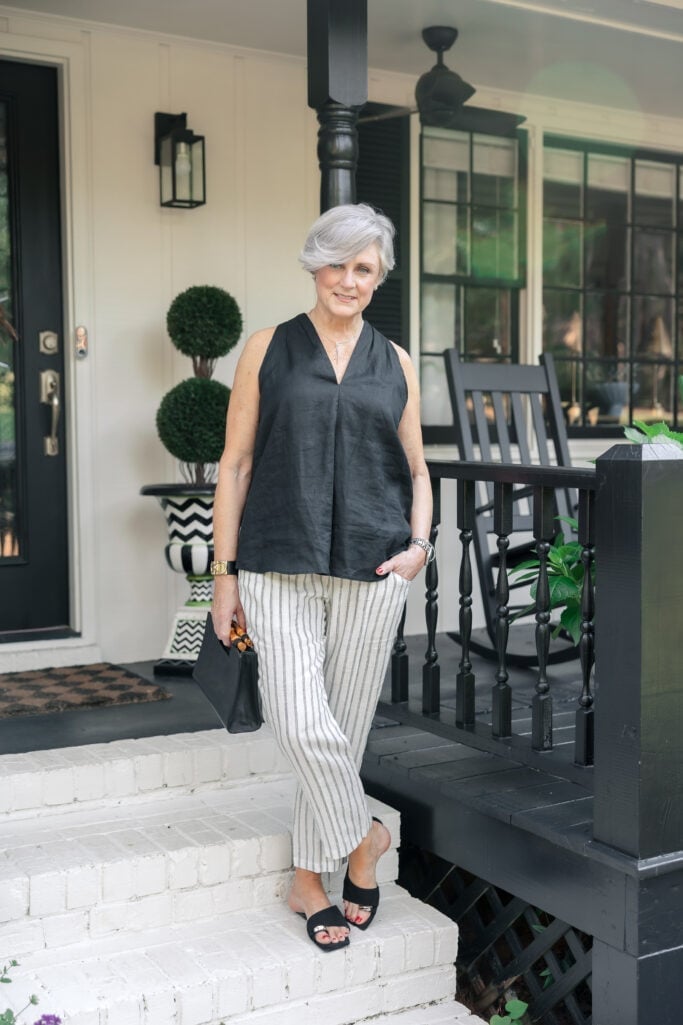 Black sleeveless top with striped linen trousers Black sleeveless top with striped linen trousers — Outfits for Women Over 50