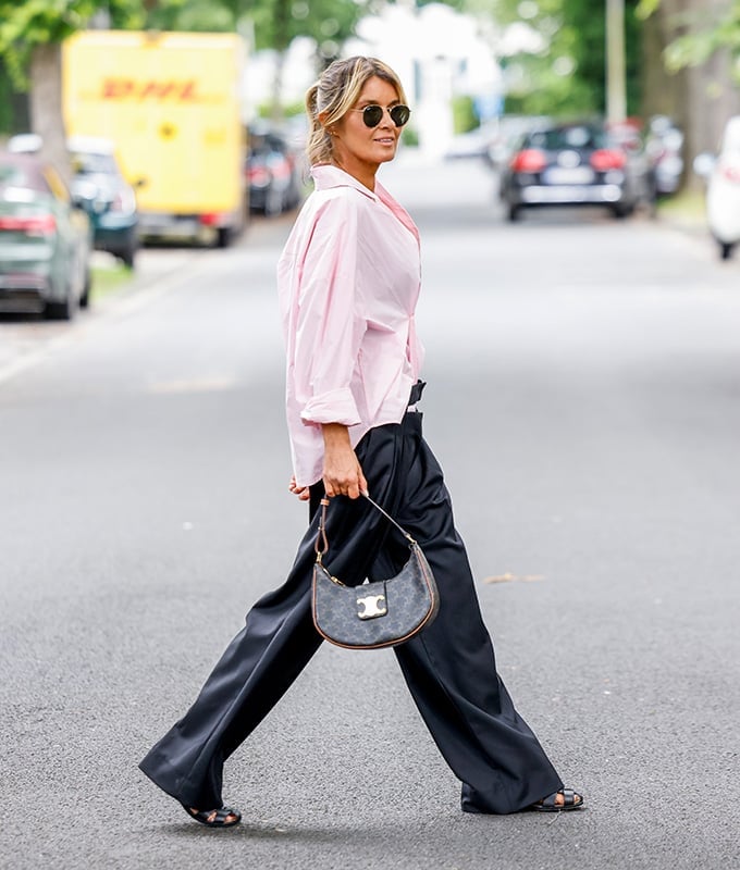 Oversized pink button-down shirt with black satin trousers Oversized pink button-down shirt with black satin trousers — Outfits for Women Over 50
