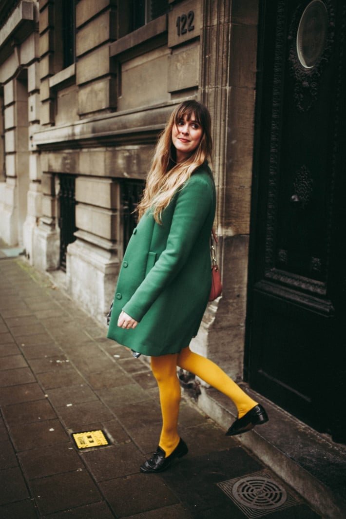 Green wool coat with bright yellow opaque tights Green wool coat with bright yellow opaque tights — Outfits with Tights