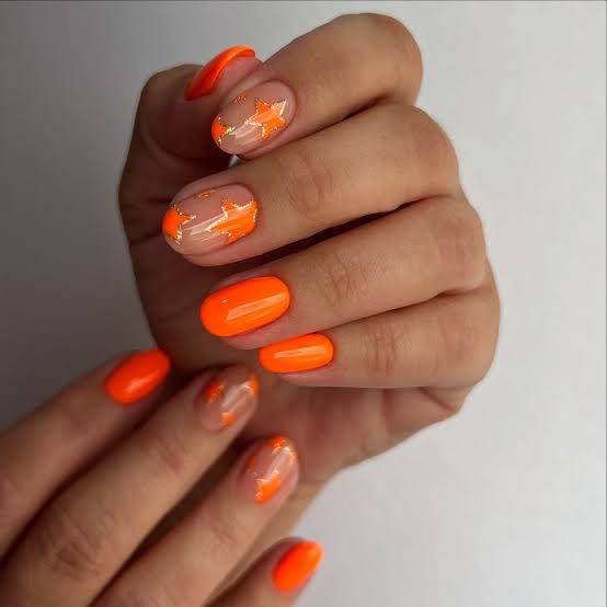 Vibrant Orange And Star Short Oval Nails Vibrant Orange And Star Short Oval Nails