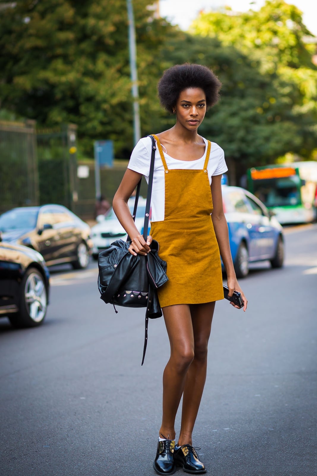 Mustard corduroy overall dress with a t-shirt and loafers Mustard corduroy overall dress with a t-shirt and loafers — Overalls Outfits