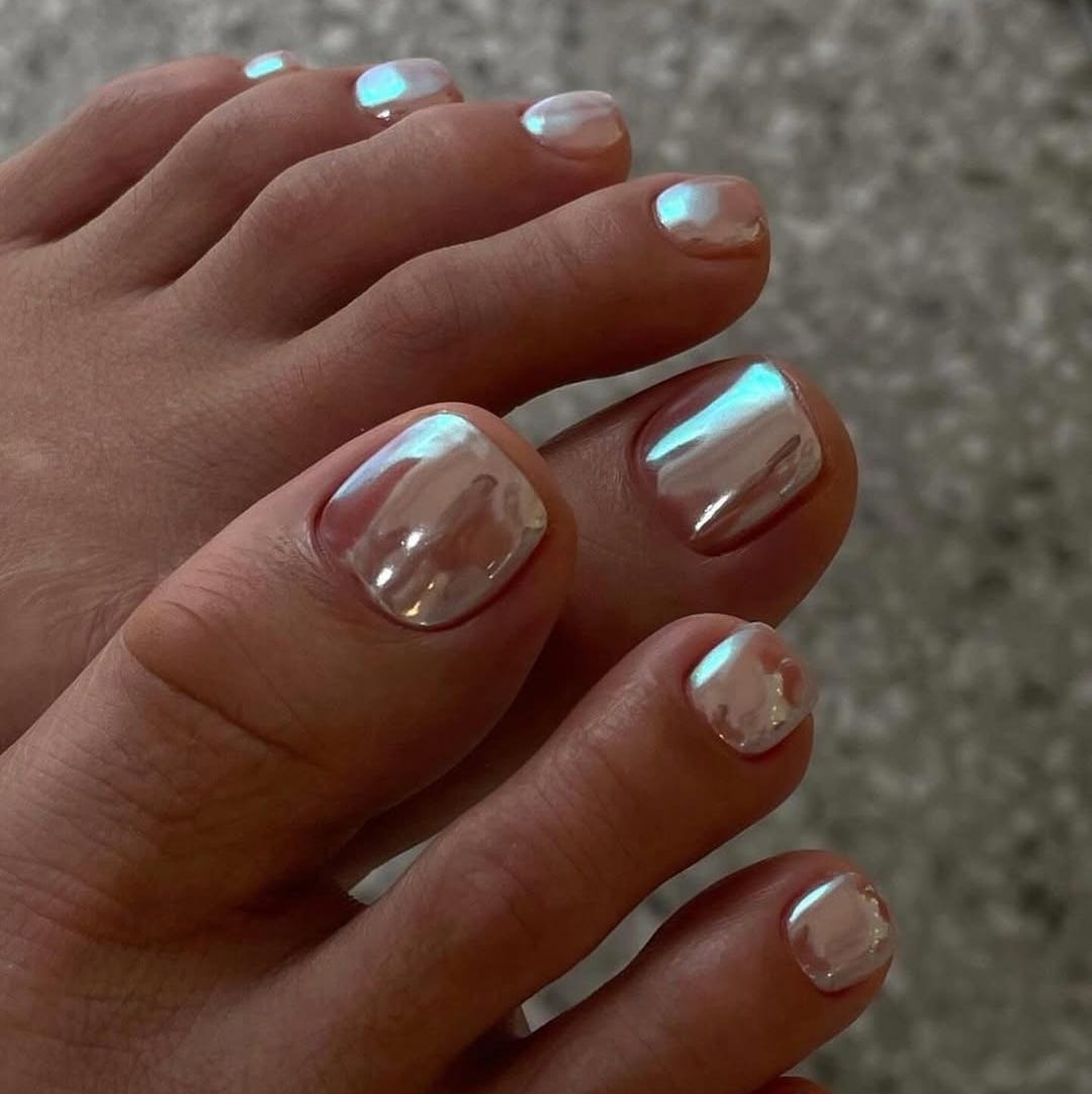 High-Shine Silver Chrome Short Almond Pedicure, Appearing As A Soft High-Shine Silver Chrome Short Almond Pedicure, Appearing As A Soft — Pedicure Nails