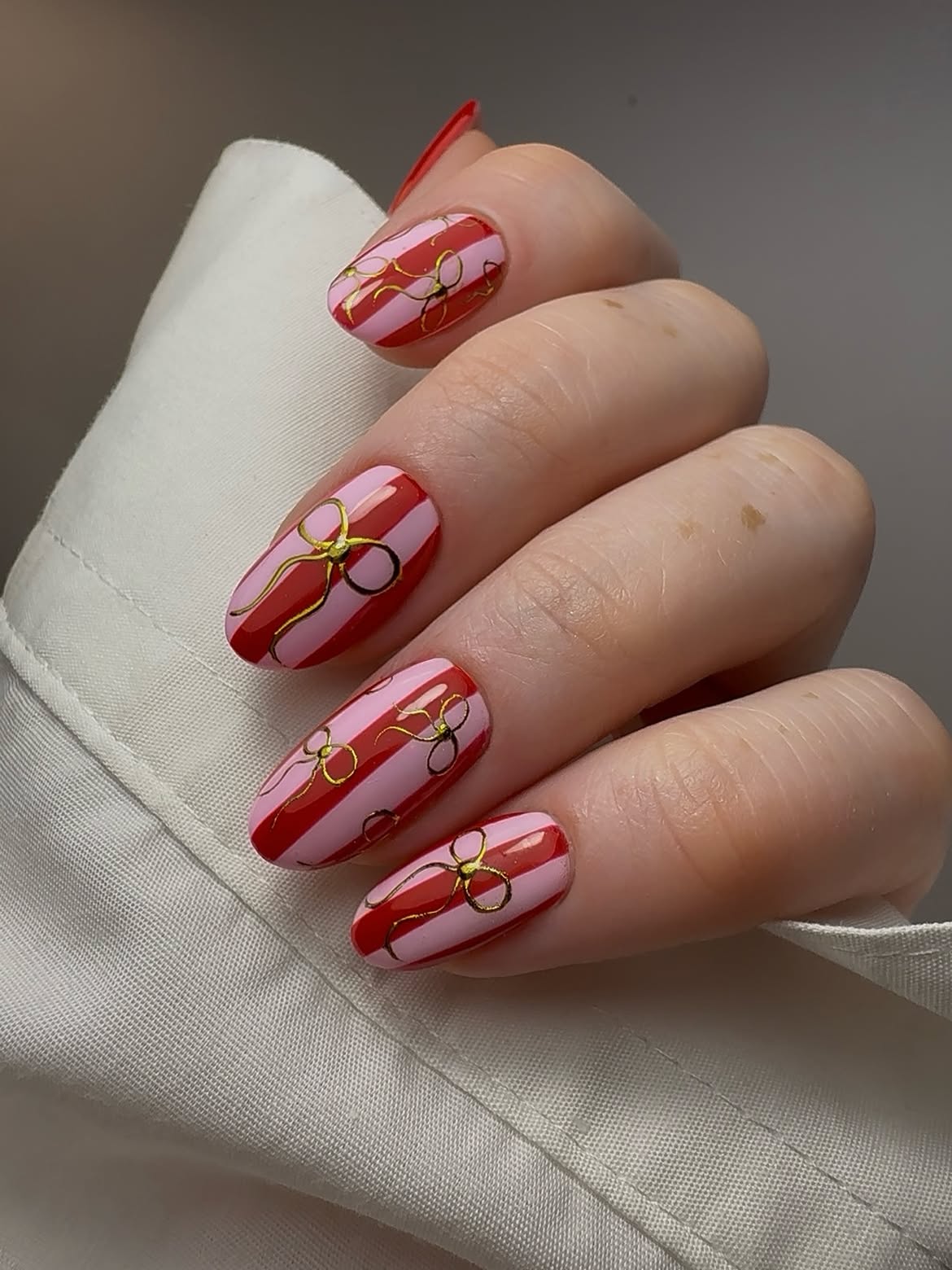 Pink and Red Striped Bow Accent Nails