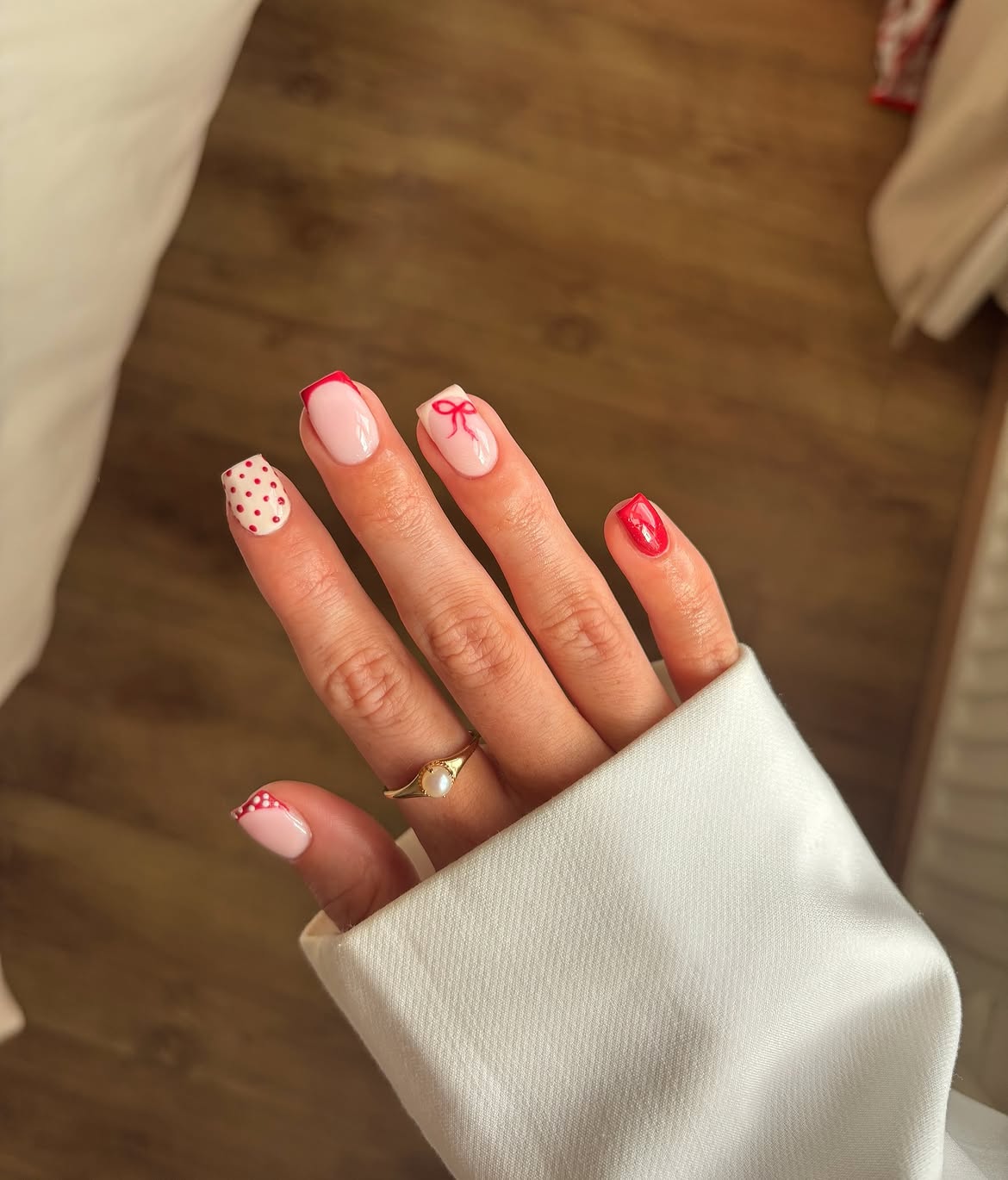 Pink French Tip Nails with Red Bows and Polka Dots