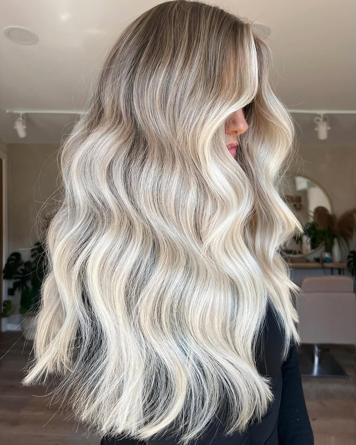 Platinum Blonde Waves With Face-Framing Layers