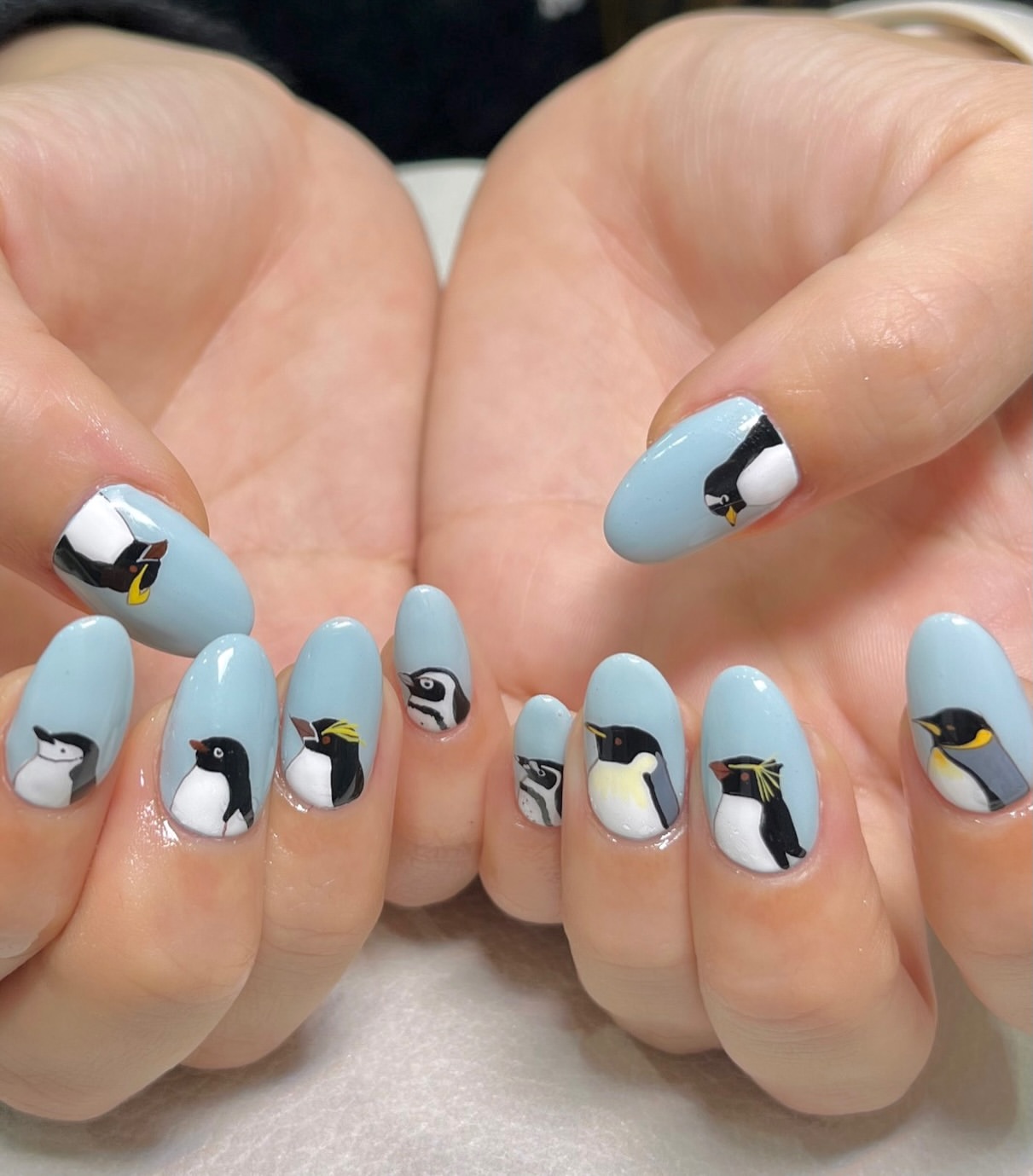 Playful Penguin Parade Oval Nails