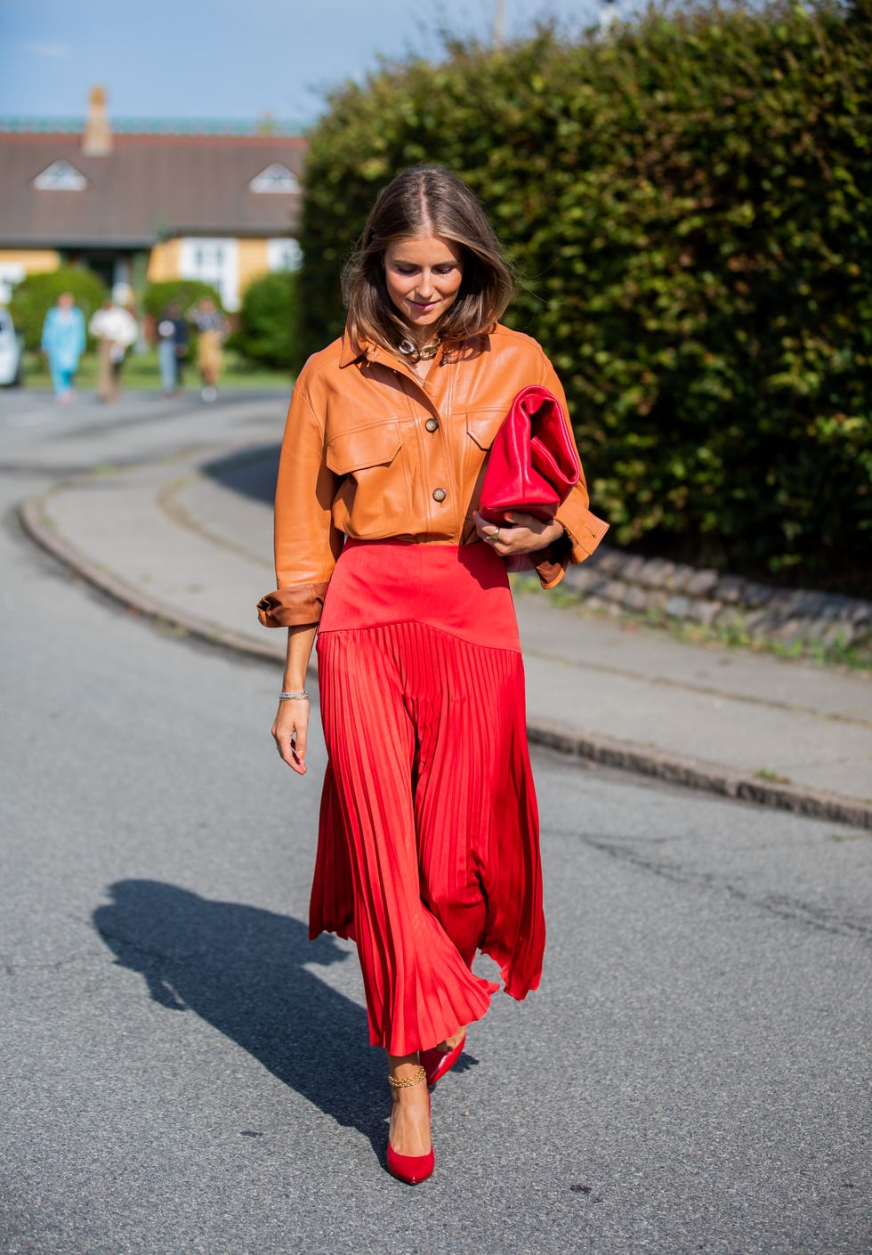 Bold red ombre pleated midi skirt with orange leather jacket Bold red ombre pleated midi skirt with orange leather jacket — Pleated Skirt Outfits